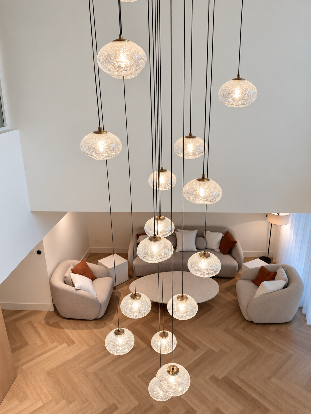 Elegant dining area with staircase and pendant lighting