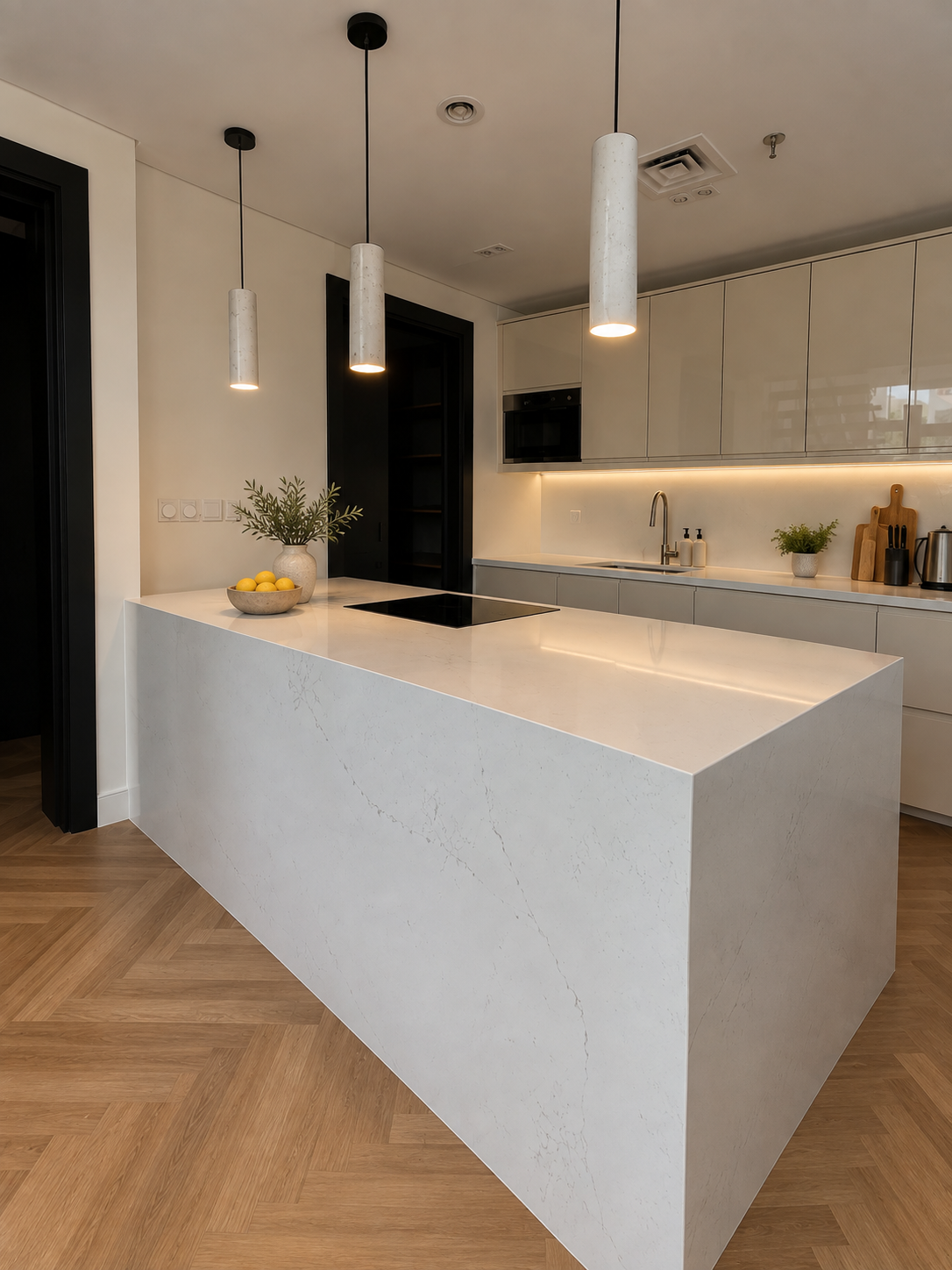 Modern kitchen featuring an island, cabinetry, and pendant lighting
