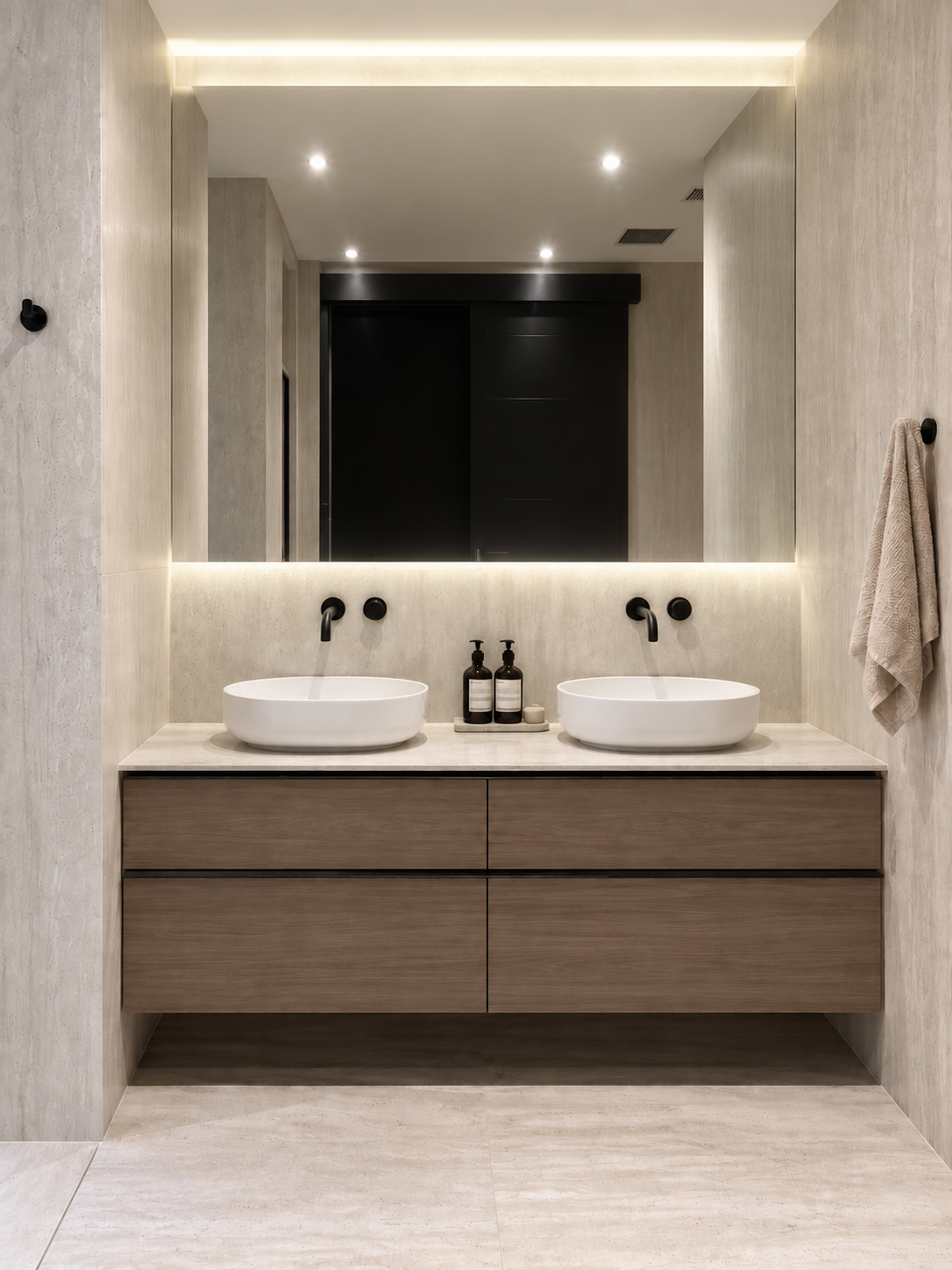 Double vanity with two white vessel sinks, timber vanity and large mirror